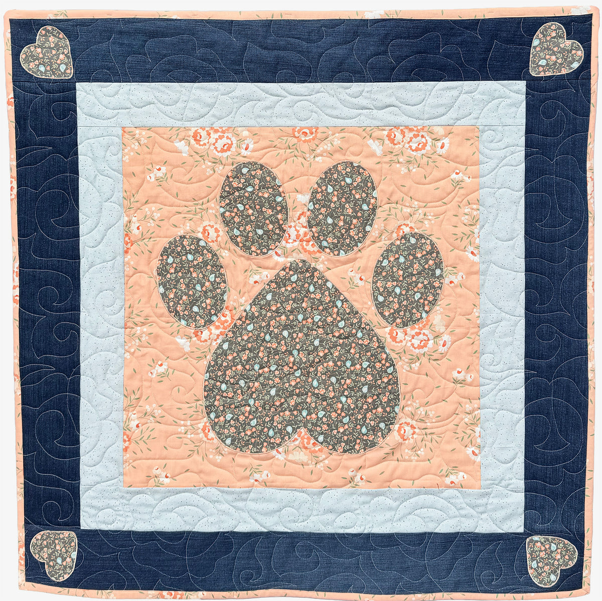 Pink and blue Positively Yours quilt with an upcycled denim outer border