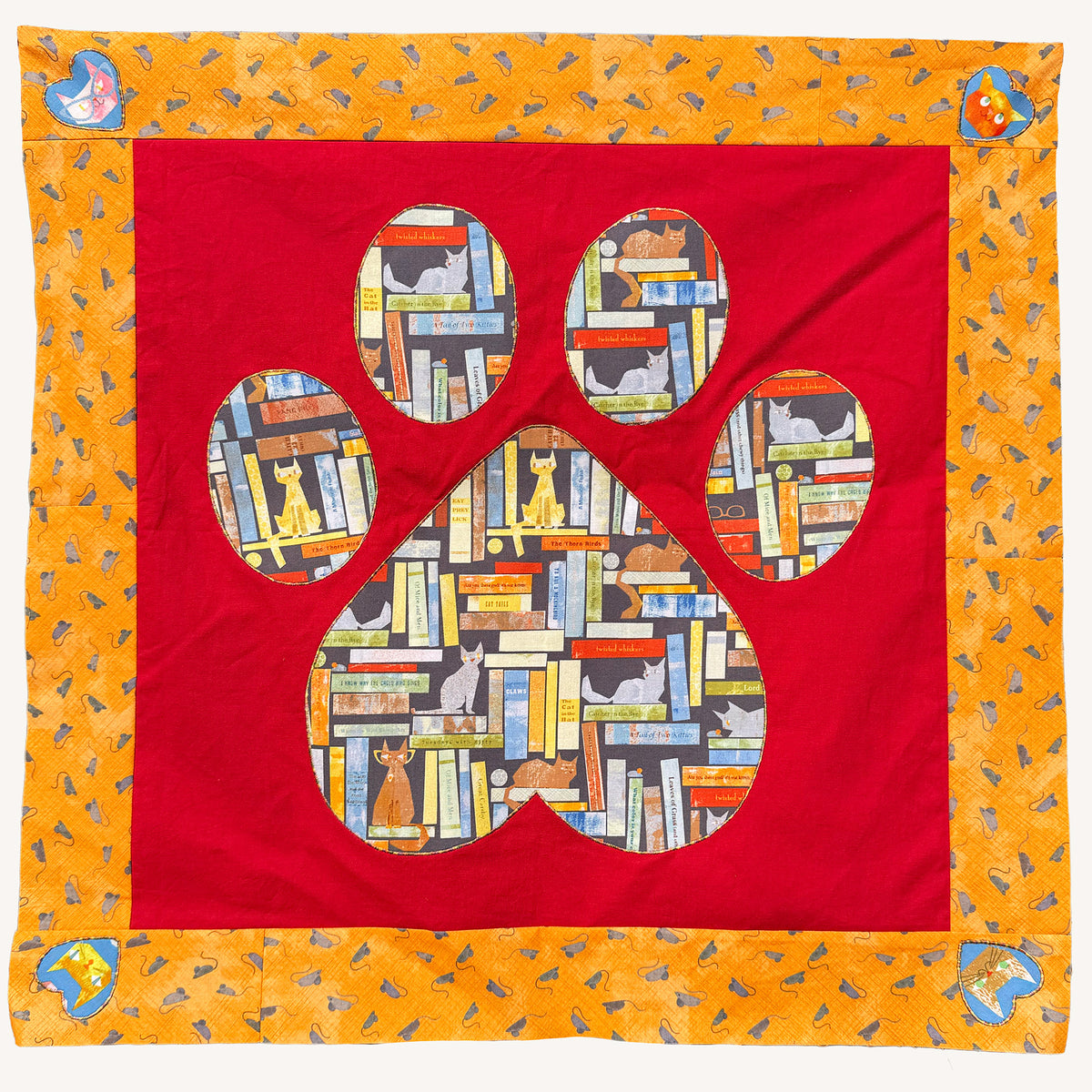 Positively Yours quilt colorway featuring cat-print fabric in the paw blocks